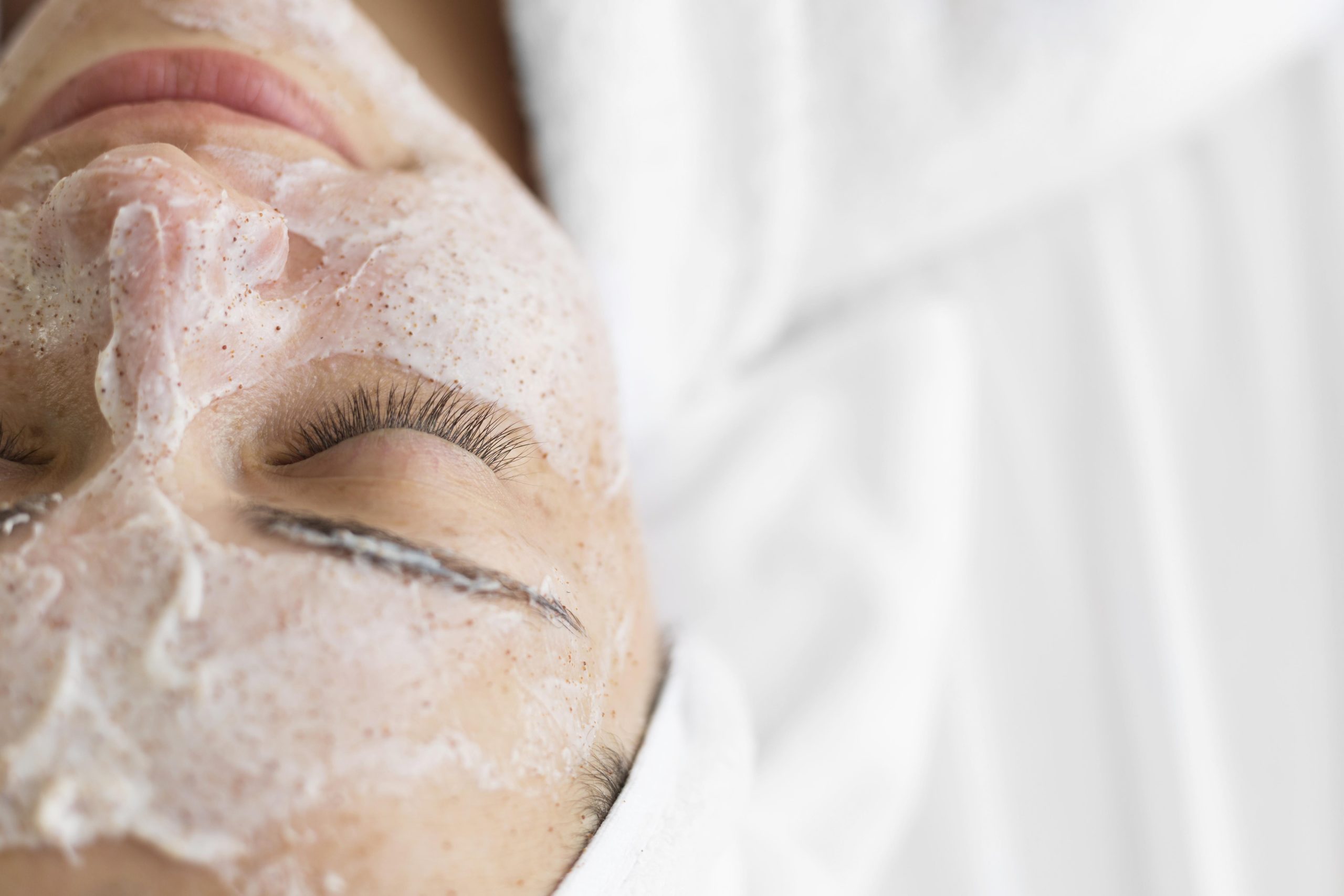 close up woman using face cream